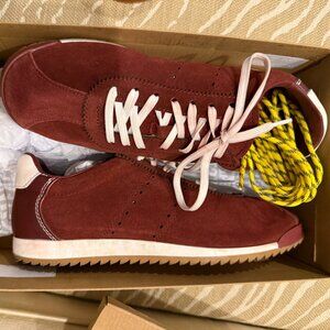 Steve Madden Mirage Burgundy Suede Sneakers with White and yellow shoelaces.